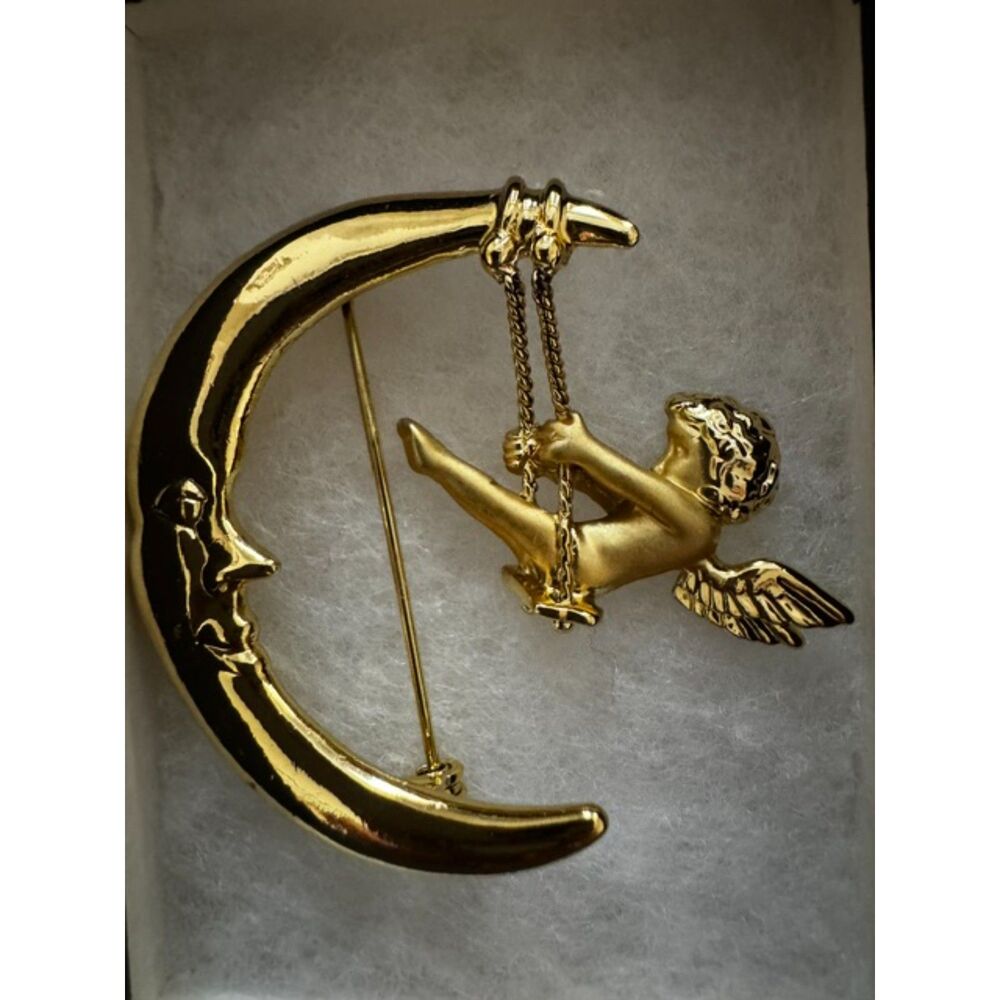 AJC gold-tone Crescent man-in-the-moon with articulated cherub.